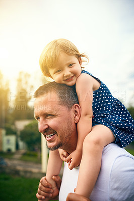 Buy stock photo Cropped shot of a father and his adorable daughter spending time together outside