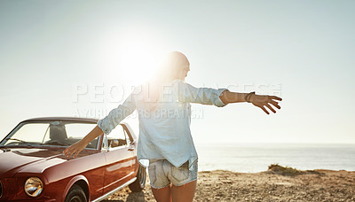 Buy stock photo Shot of a beautiful young woman going on a road trip to the beach