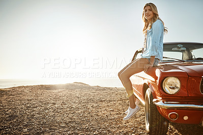 Buy stock photo Portrait of a beautiful young woman relaxing on the hood of her car on a road trip