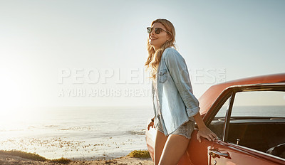 Buy stock photo Shot of a beautiful young woman going on a road trip to the beach