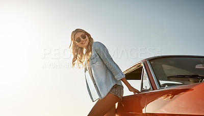 Buy stock photo Shot of a beautiful young woman going on a summer’s road trip