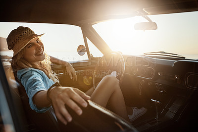 Buy stock photo Portrait of a young woman enjoying a road trip along the coast