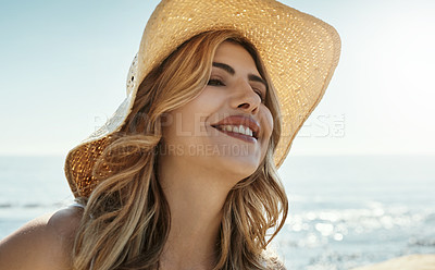 Buy stock photo Shot of an attractive young woman enjoying her day on the beach