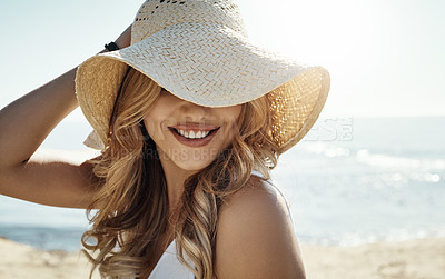 Buy stock photo Shot of an attractive young woman enjoying her day on the beach