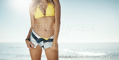 Buy stock photo Cropped shot of an attractive young woman spending a summer's day on the beach