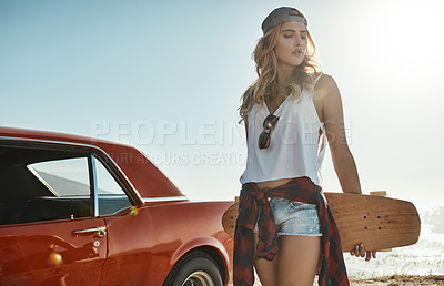 Buy stock photo Cropped shot of an attractive young woman holding a skateboard while on a road trip