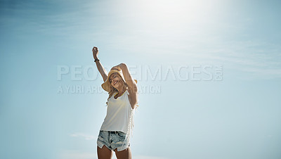 Buy stock photo Portrait of an attractive young woman enjoying a summer's day outdoors