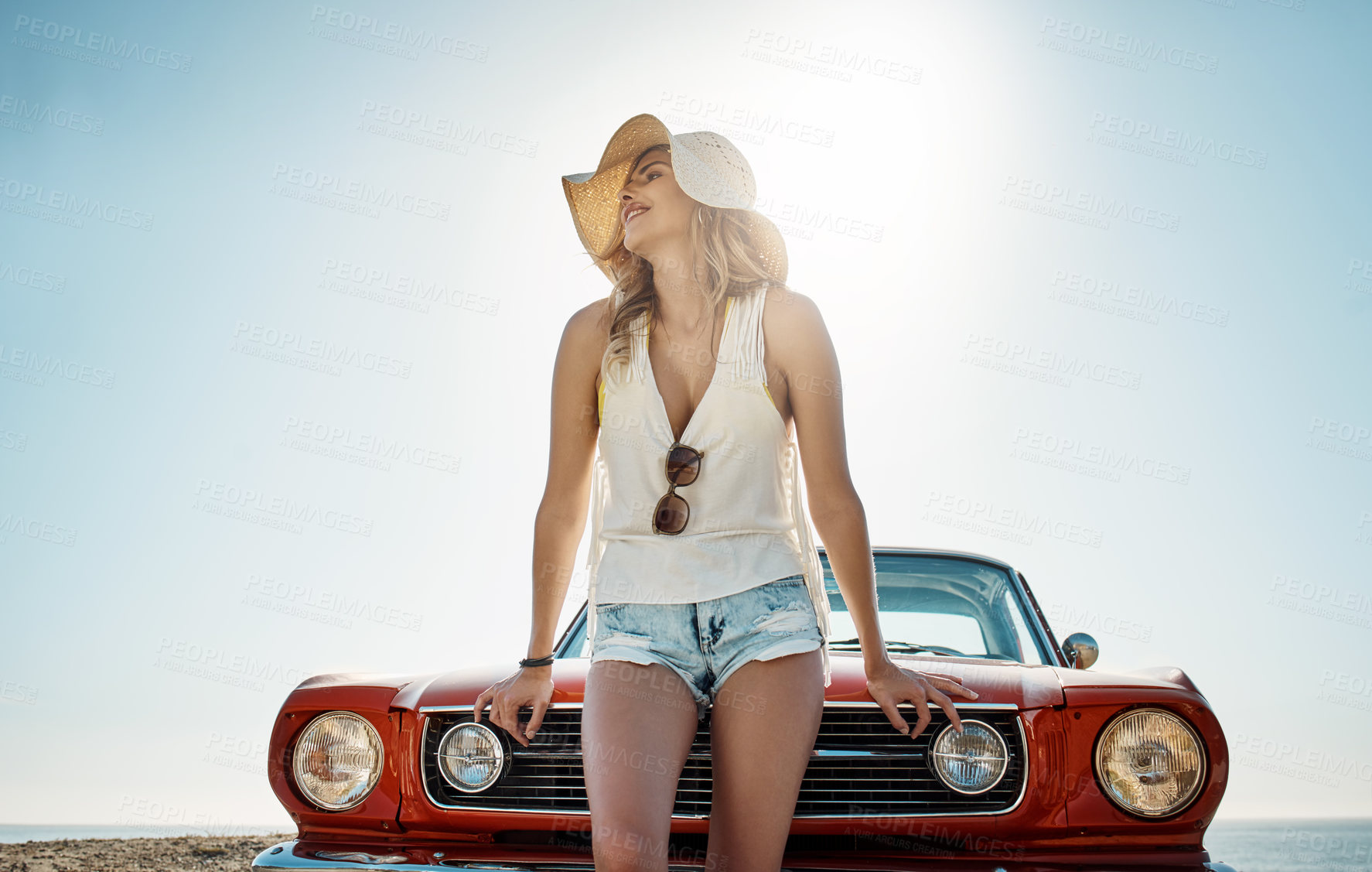 Buy stock photo Cropped shot of an attractive young woman on a road trip
