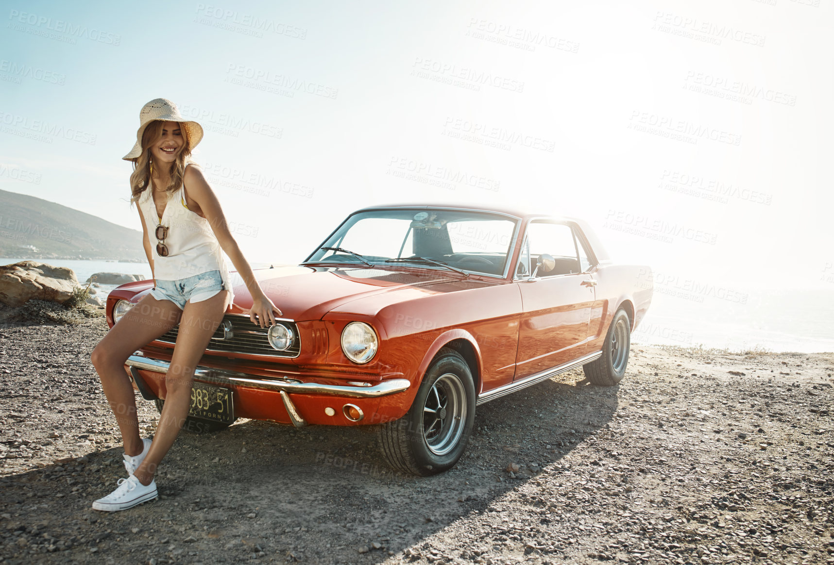 Buy stock photo Shot of an attractive young woman on a road trip