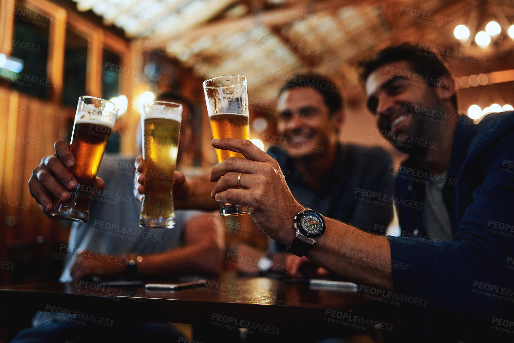 Buy stock photo Friends, men and toast with beer at pub for social gathering, communication and relax in restaurant. People, support and cheers with alcohol beverage for happy hour, celebration and reunion together