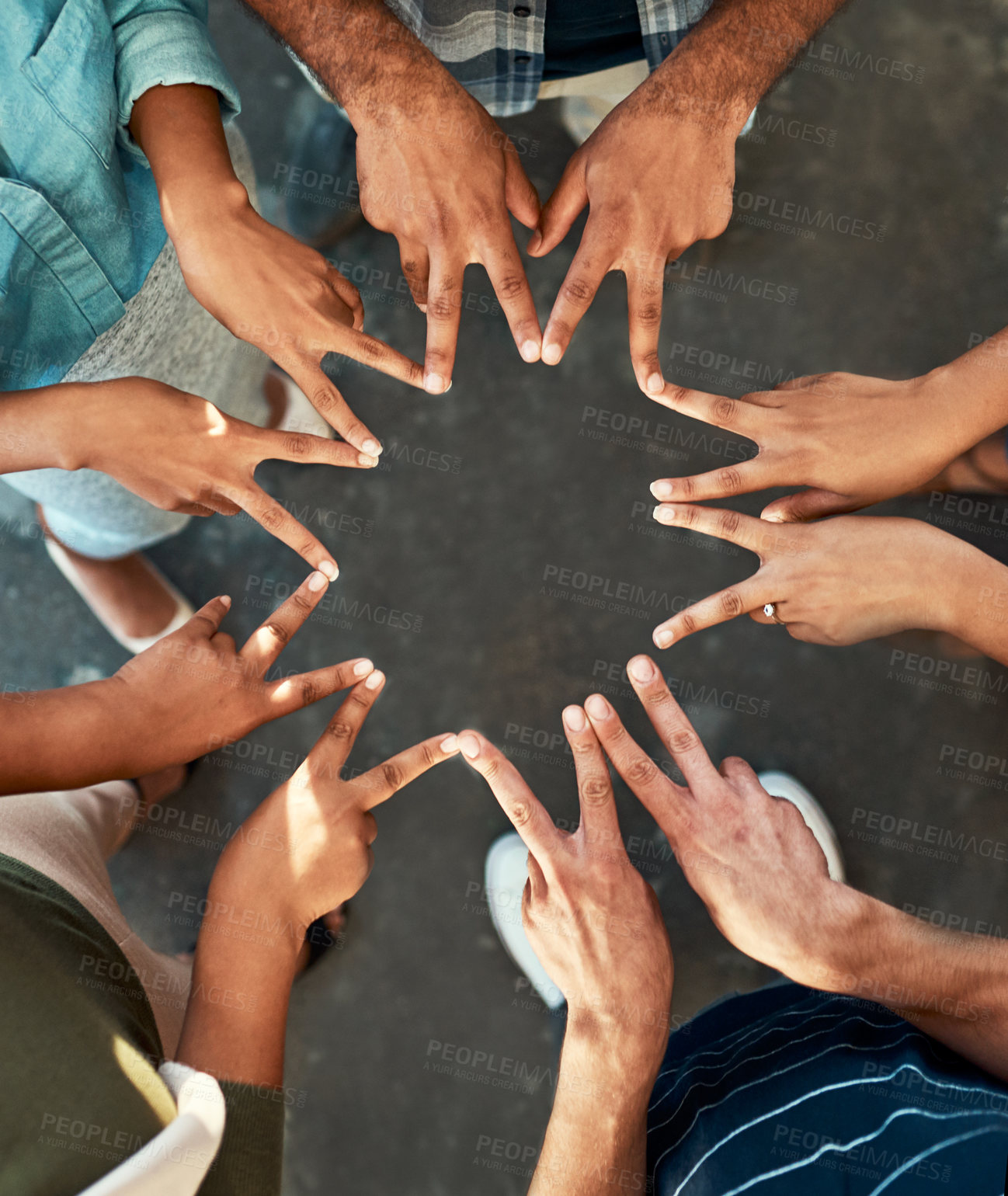 Buy stock photo High angle shot of an unrecognizable group of work colleagues forming an unique huddle with their fingers while standing in the office at work