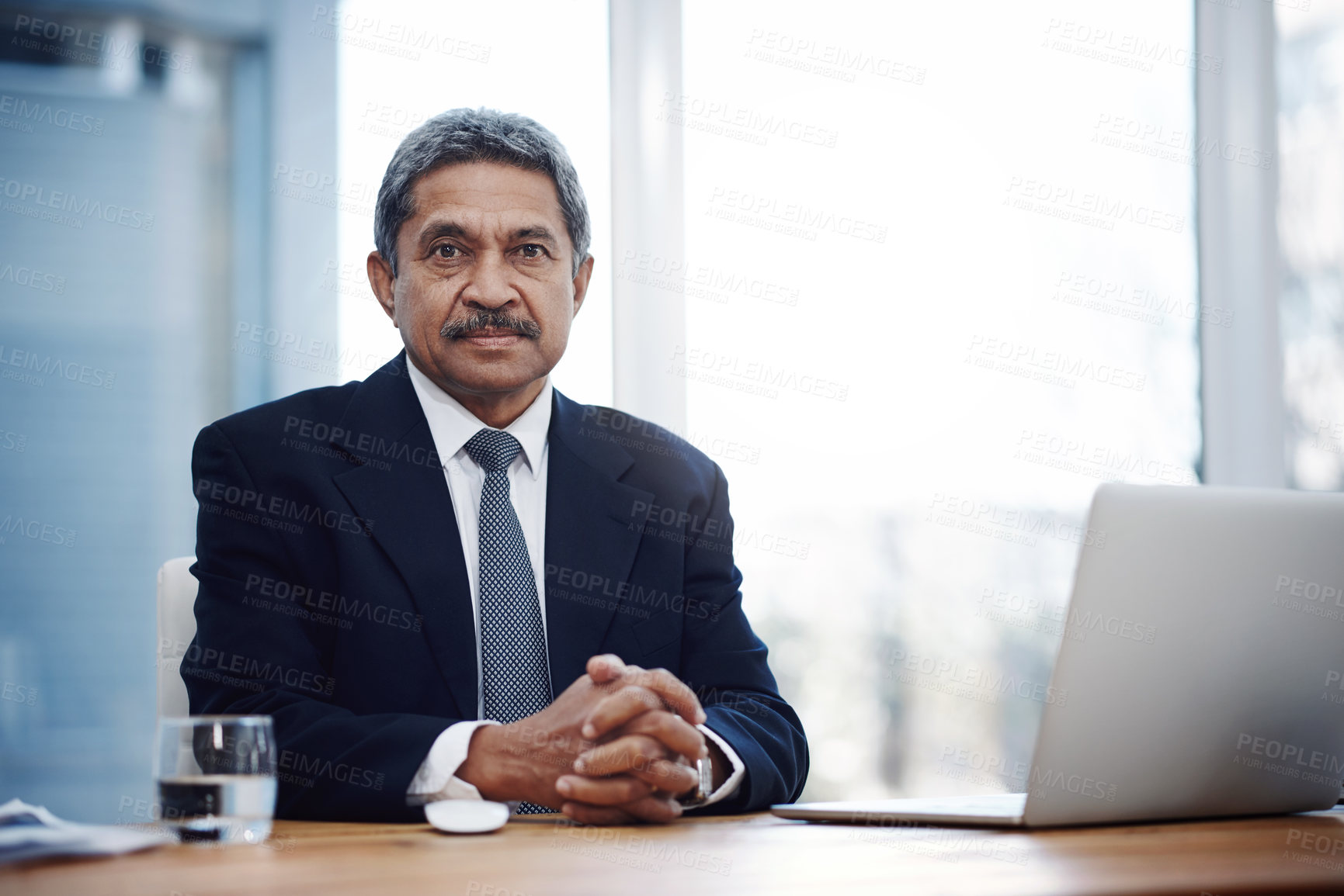 Buy stock photo Portrait of a mature businessman working in an office