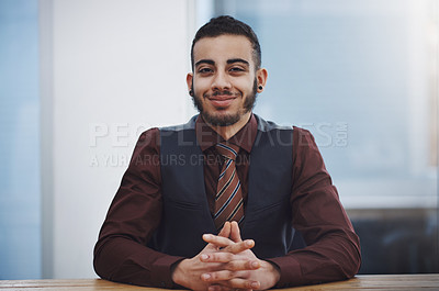 Buy stock photo Portrait of a young businessman sitting in an office