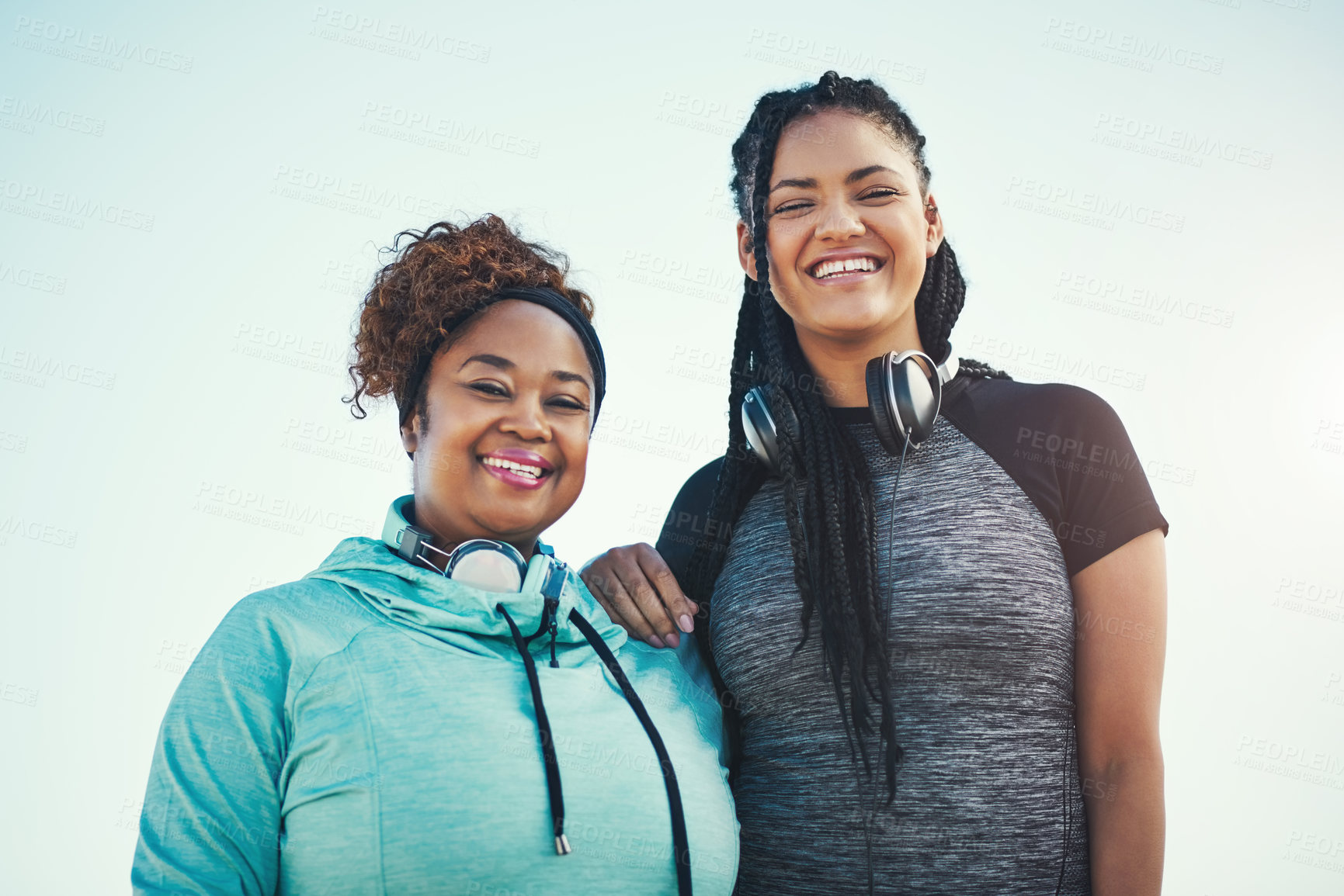 Buy stock photo Portrait of two sporty young women standing together outdoors