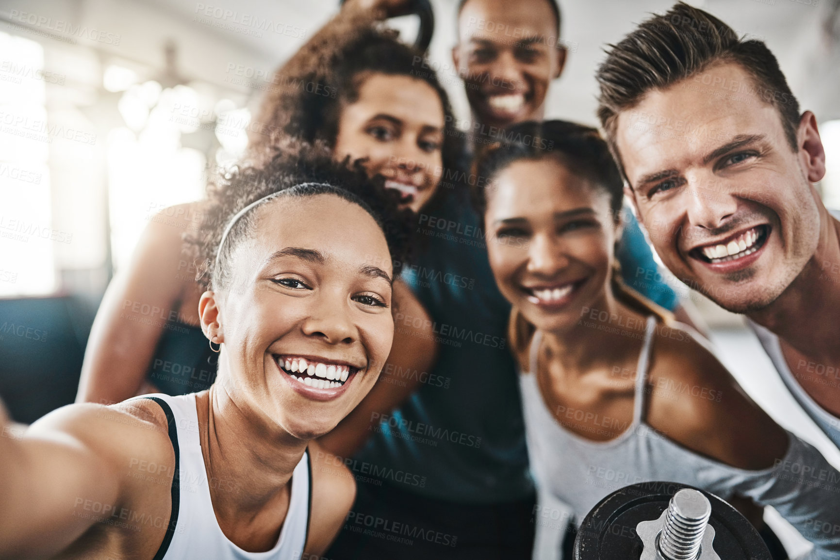 Buy stock photo Shot of a group of young people taking a selfie together during their workout in a gym