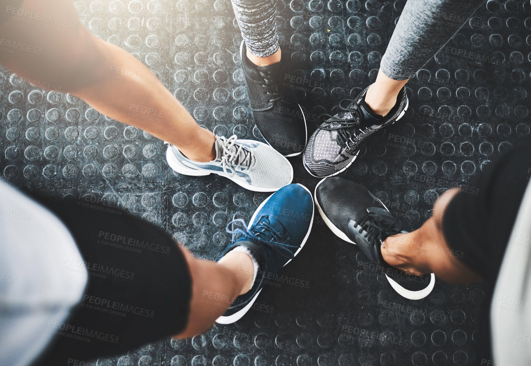 Buy stock photo Cropped shot of a group of people standing together in a circle at the gym