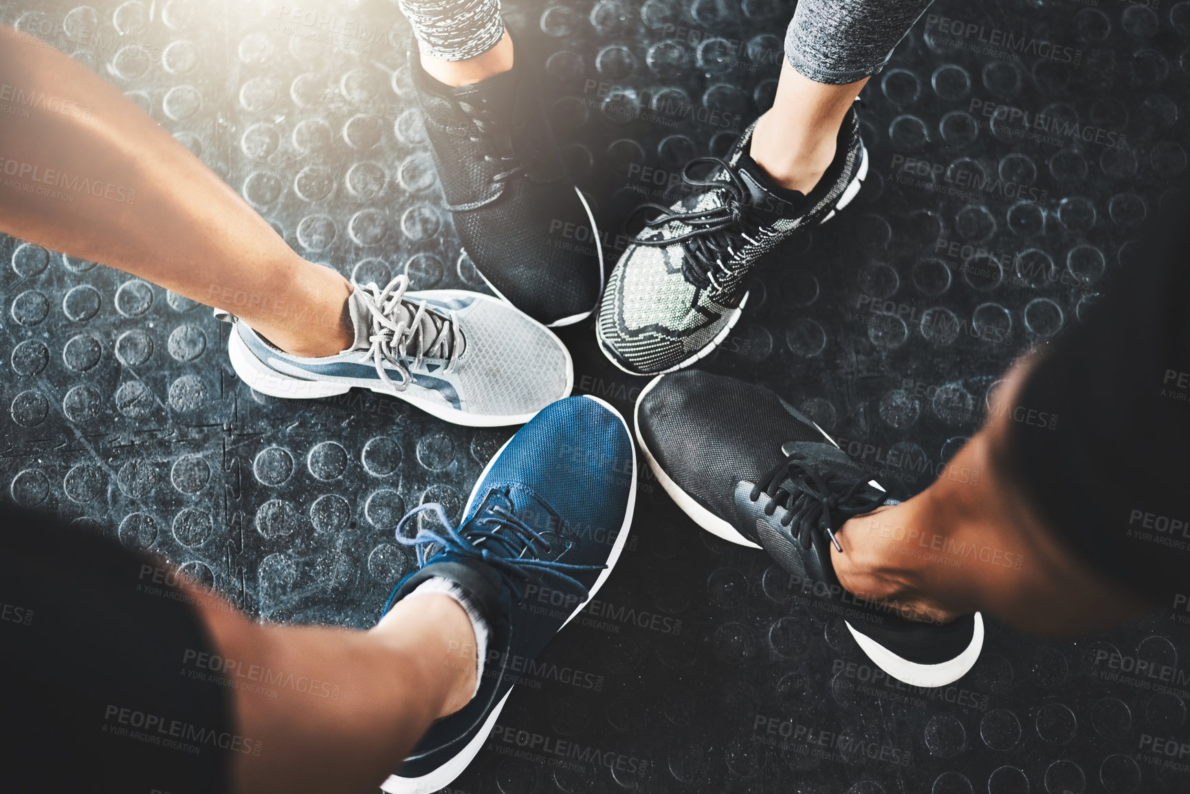 Buy stock photo Cropped shot of a group of people standing together in a circle at the gym
