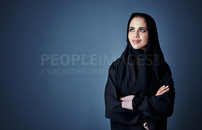 Buy stock photo Cropped shot of an attractive young businesswoman standing with her arms folded against a dark background