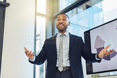 Buy stock photo Shot of a young businessman enthusiastically delivering a presentation in the boardroom of a modern office