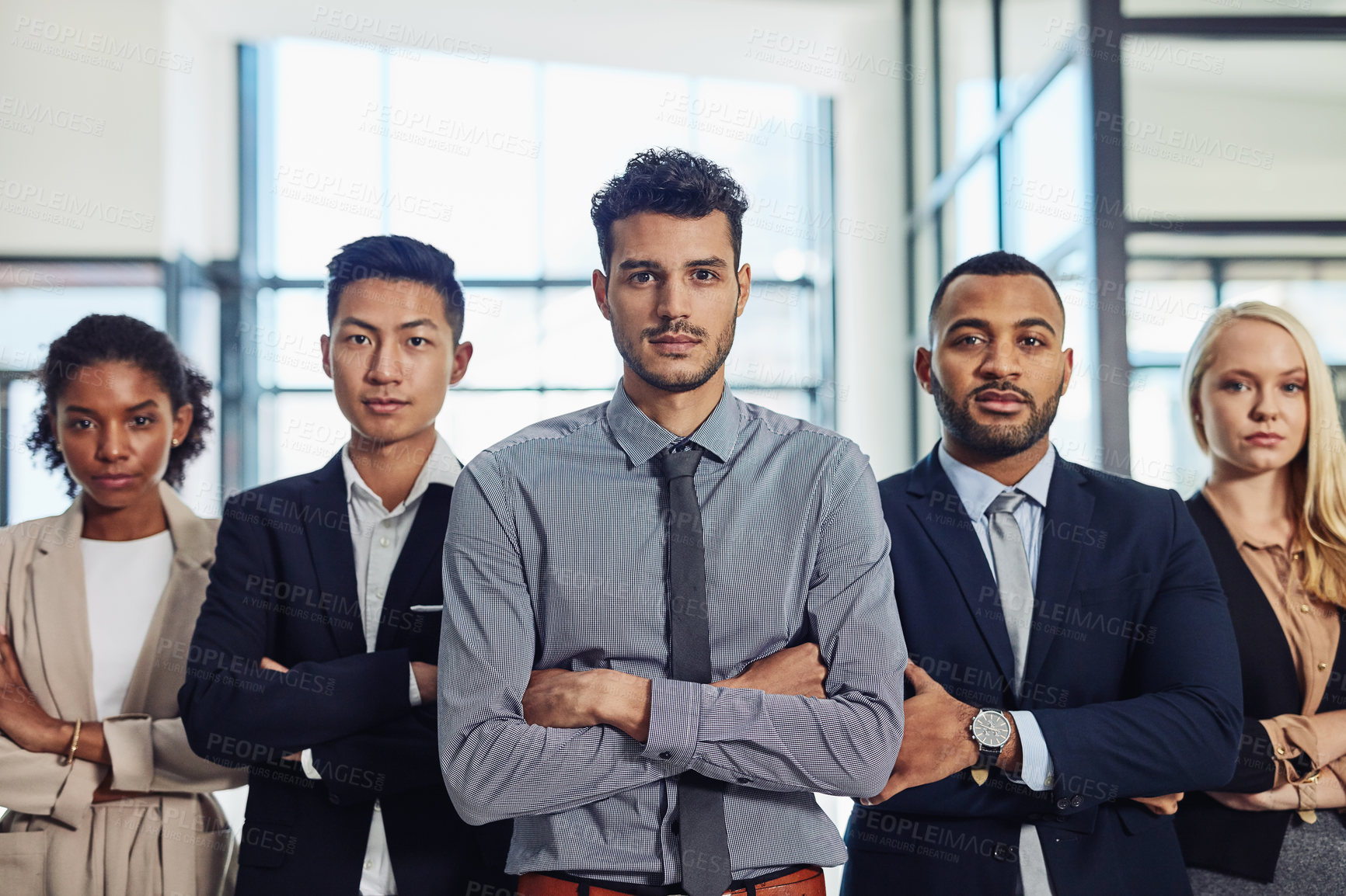 Buy stock photo Shot of a group of confident and diverse young businesspeople working together in a modern office