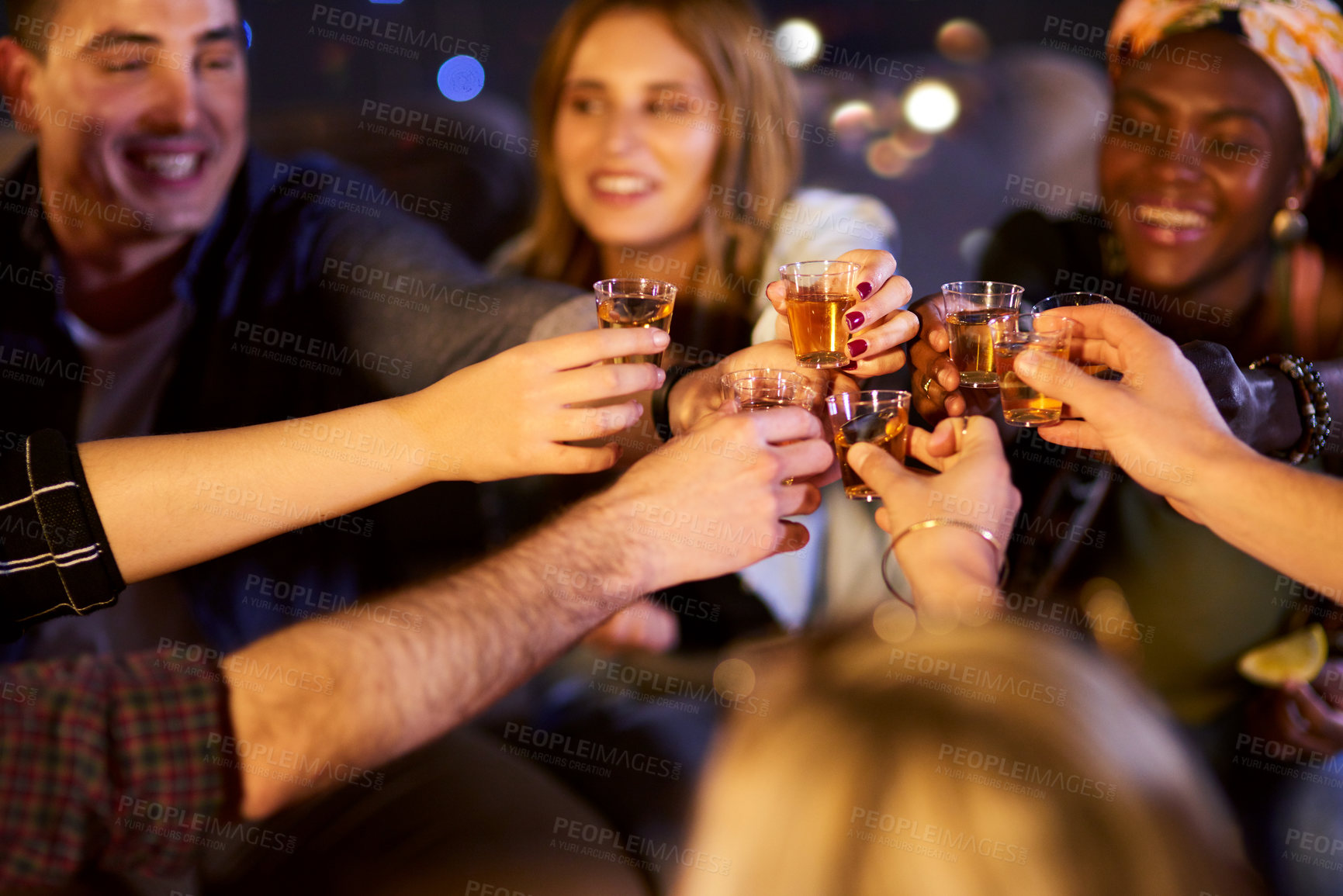 Buy stock photo Cropped shot of a group of friends having fun at a nightclub