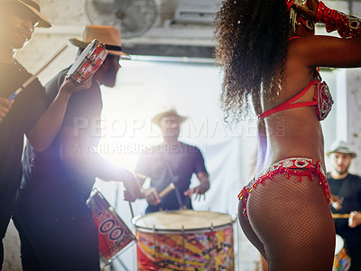 Buy stock photo Low angle shot of an unrecognizable woman wearing festive clothing while dancing to music played by a band inside of a club at night