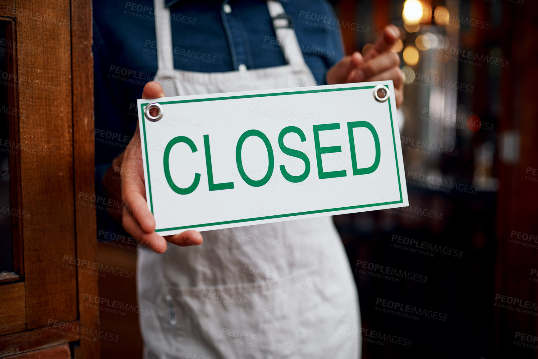Buy stock photo Closeup of a unrecognizable business owner holding up a sign saying 