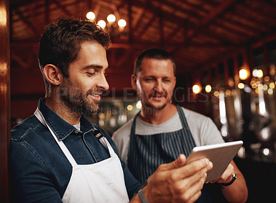 Buy stock photo Men, tablet and barista with confidence, small business and colleagues as entrepreneur in cafe. Male people, waiter and technology in industry, hospitality or customer service with pride at workplace