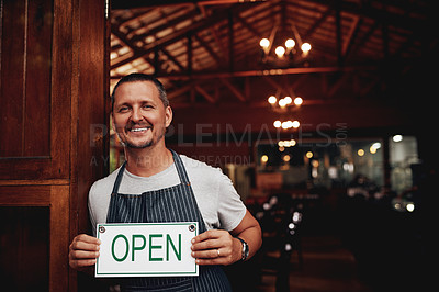 Buy stock photo Entrance, portrait and man with open sign for brewery, invite clients and welcome patrons for customer service. Restaurant, owner and board with message for hospitality,  doorway and small business