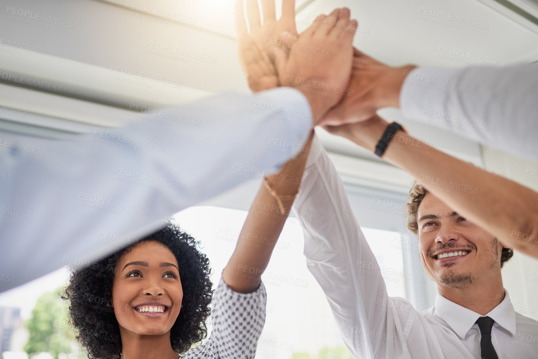 Buy stock photo Cropped shot of a group of businesspeople joining their hands in solidarity