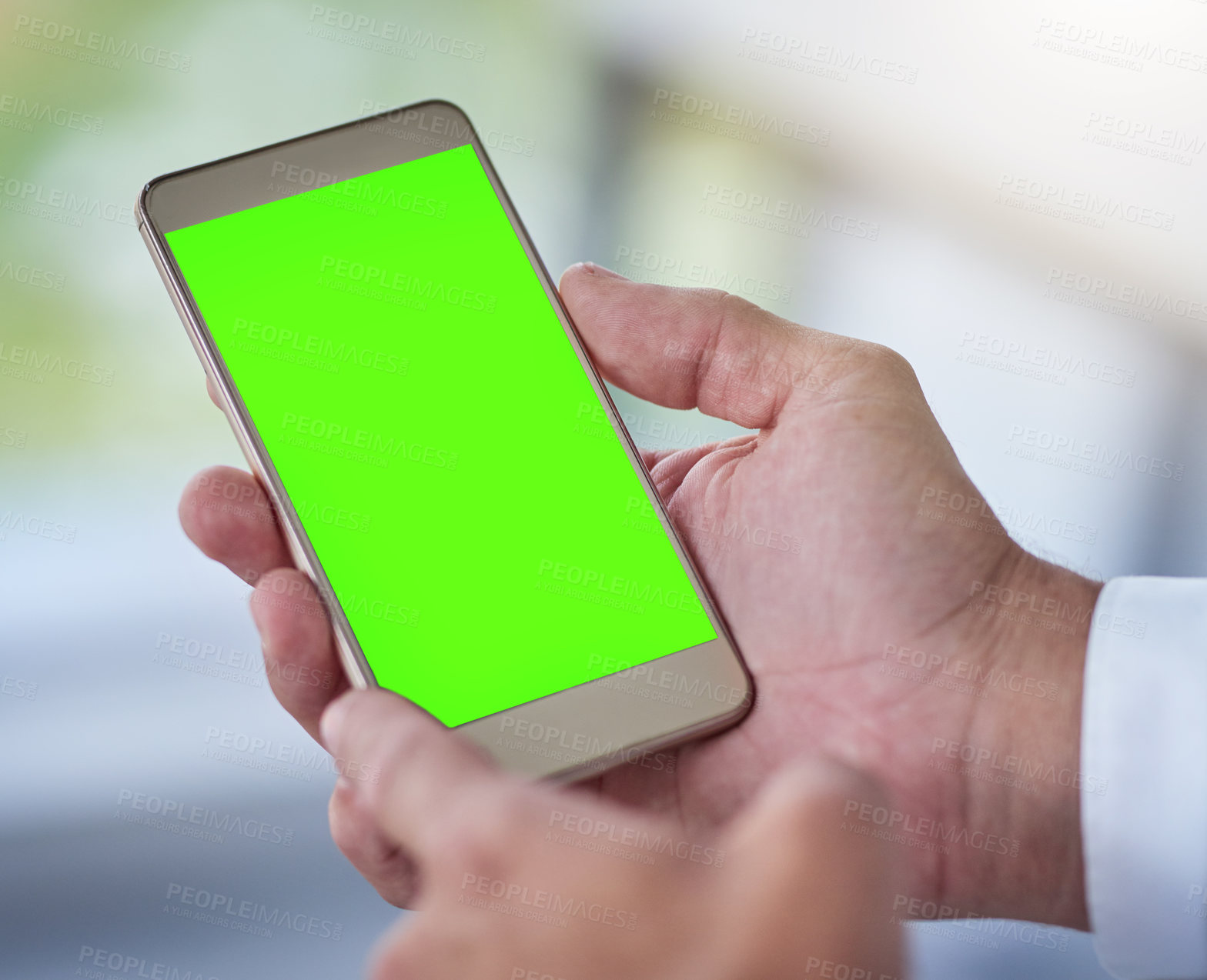 Buy stock photo Cropped shot of a businessman using a mobile phone with a green screen in a modern phone