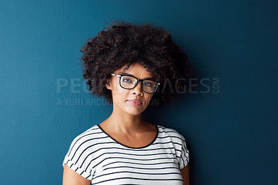 Buy stock photo Black woman, portrait and serious with glasses for optometry or vision and on blue studio background. Girl, spectacle and confident for wellness, eye care and healthcare with beauty or mockup space