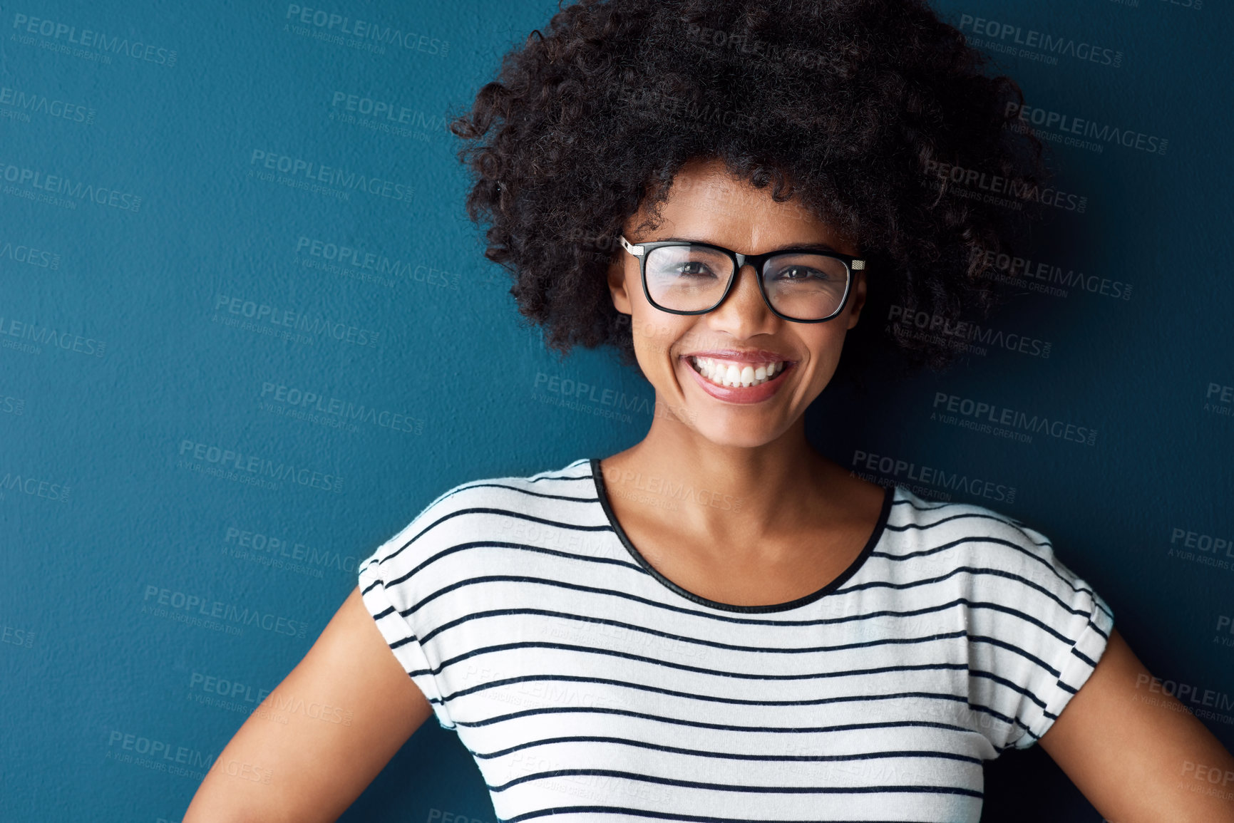 Buy stock photo Black woman, portrait and smile with glasses for optometry or vision and on blue background. Girl, spectacle and confident for wellness, eye care and funny comedy with mockup space or confidence