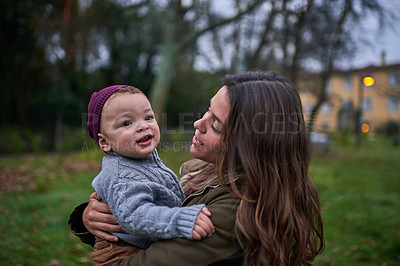 Buy stock photo Shot of a mother bonding with her little son outdoors