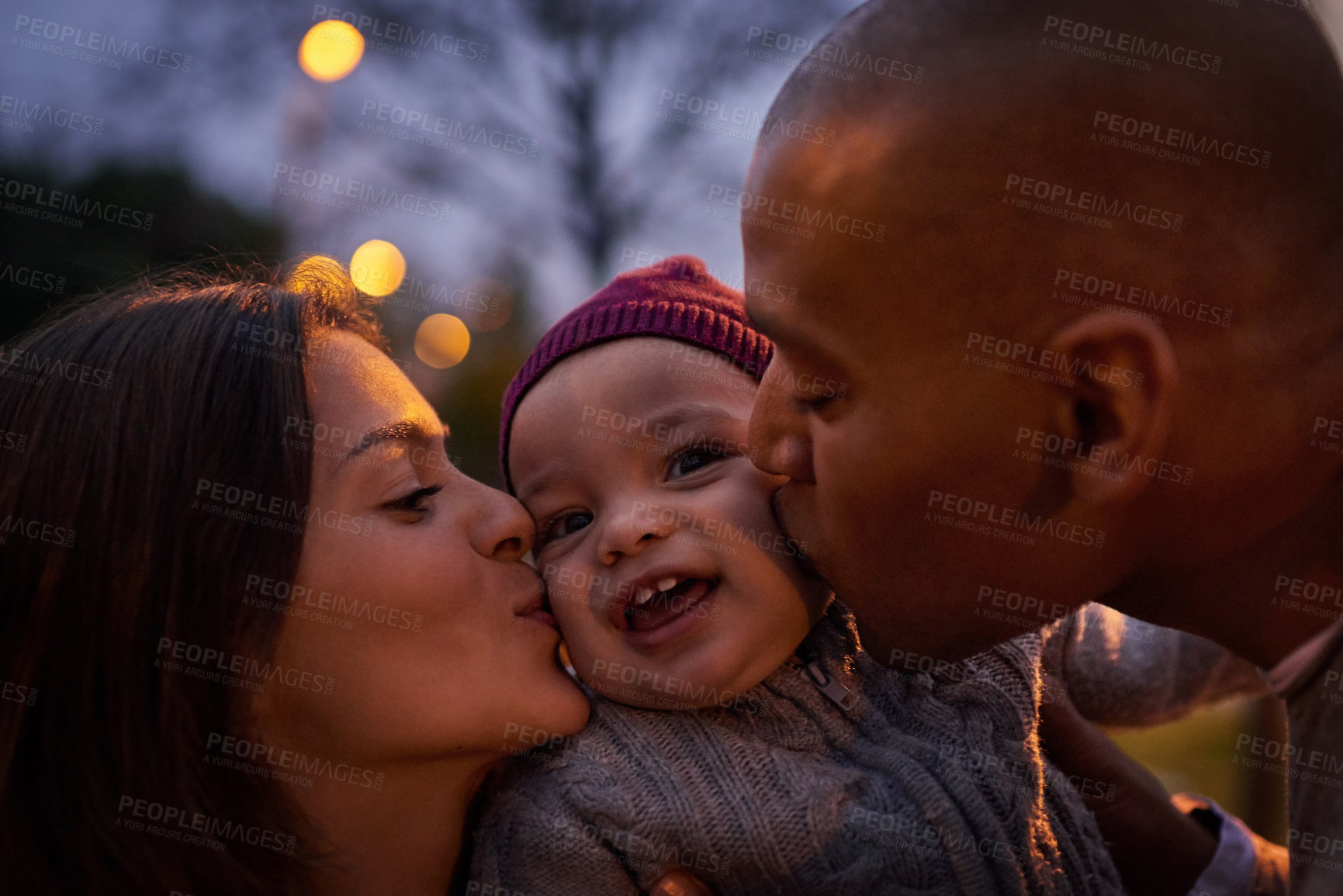 Buy stock photo Bonding, parents and kiss for baby, outdoor and outing with boy, night and adorable toddler with family. Affection, mother and father with youth, love and celebration of mothers day and smile