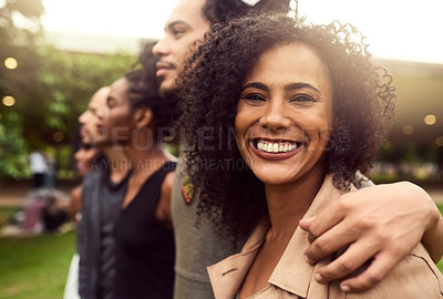 Buy stock photo Cropped shot of a group of friends standing in a row in a public park