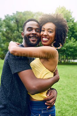 Buy stock photo Cropped portrait of an affectionate young couple spending some time together in the park
