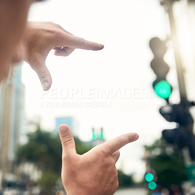Buy stock photo Closeup shot of an unrecognizable businessman framing a city background with his fingers