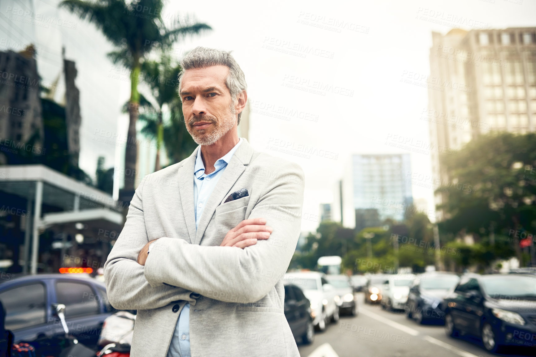 Buy stock photo Portrait of a mature businessman standing in the city