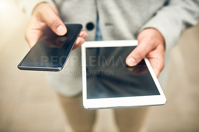 Buy stock photo Closeup shot of an unrecognizable businessman using a cellphone and digital tablet outdoors