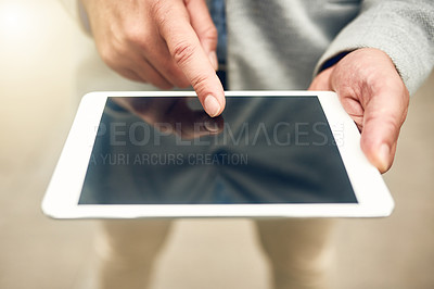 Buy stock photo Closeup shot of an unrecognizable businessman using a digital tablet outdoors