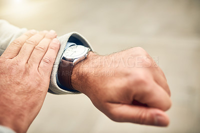 Buy stock photo Closeup shot of an unrecognizable businessman checking the time on his wrist watch