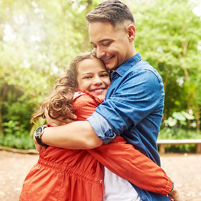 Buy stock photo Cropped portrait of an adorable young girl and her father embracing in the park