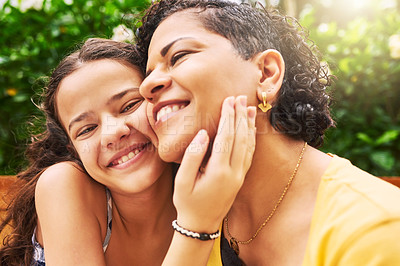 Buy stock photo Cropped portrait of an adorable young girl and her mother embracing in the park