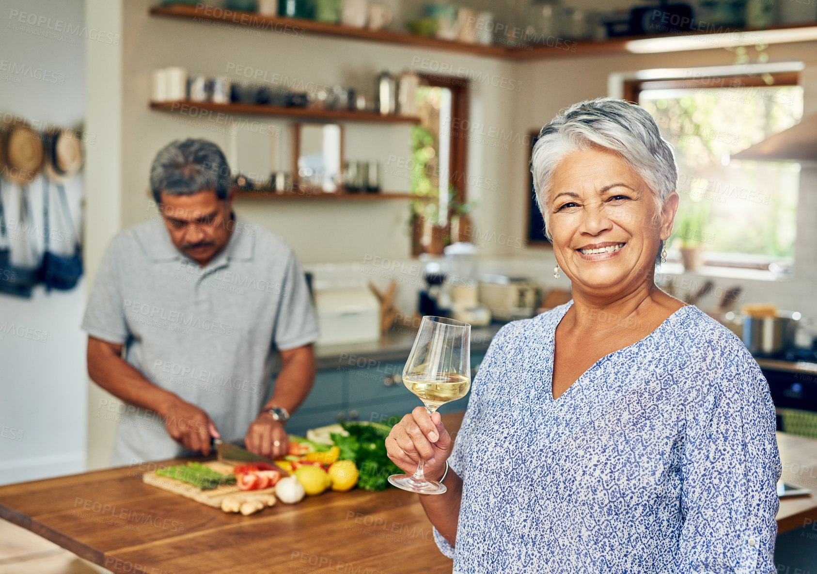 Buy stock photo Portrait of old woman in kitchen with man, wine and cooking healthy food together in home. Bonding, smile and senior couple in house with meal prep, happiness and drinks to relax in retirement time.