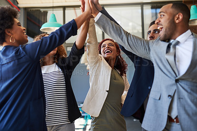 Buy stock photo Business people, high five and teamwork with motivation for unity, solidarity or mission at office. Young, excited group or employee with hands together for collaboration, success or win at workplace