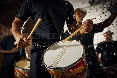 Buy stock photo Closeup shot of a musical performer playing drums with his band