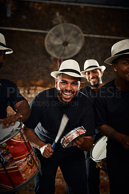 Buy stock photo Portrait of a group of musical performers playing drums together