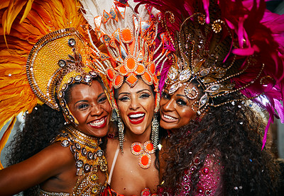 Buy stock photo Cropped portrait of three beautiful samba dancers performing in a carnival with their band