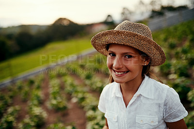 Buy stock photo Cropped portrait of a little girl standing outside on her family-owned farm